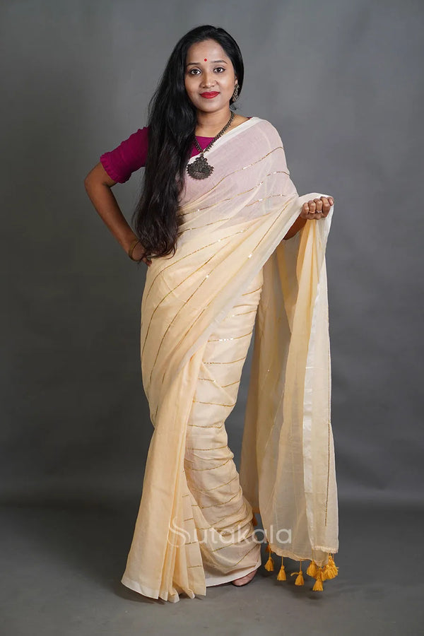 Soft Cream Handloom Cotton Saree with Golden Stripe Detailing & Tassels
