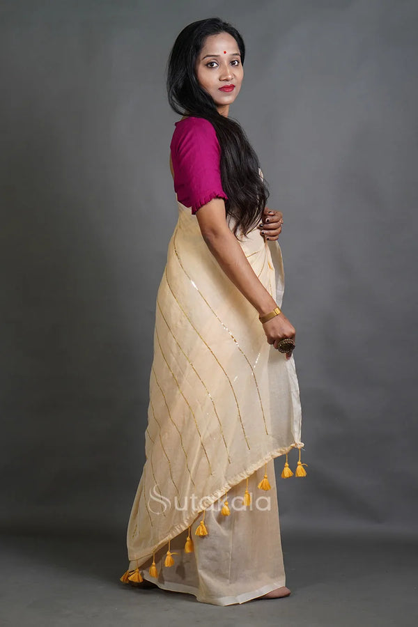 Soft Cream Handloom Cotton Saree with Golden Stripe Detailing & Tassels