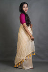 Soft Cream Handloom Cotton Saree with Golden Stripe Detailing & Tassels
